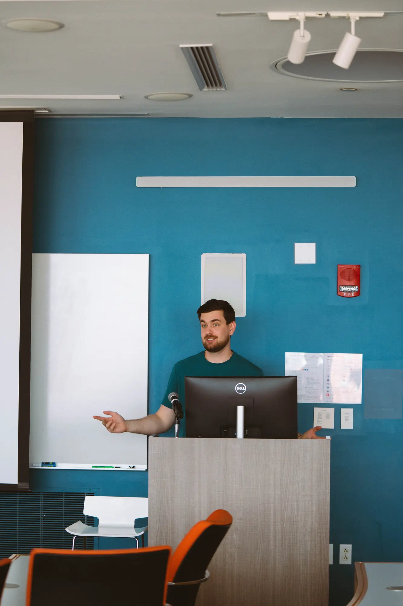 Dr. Volodymyr Kachmar delivering a professional dental lecture.