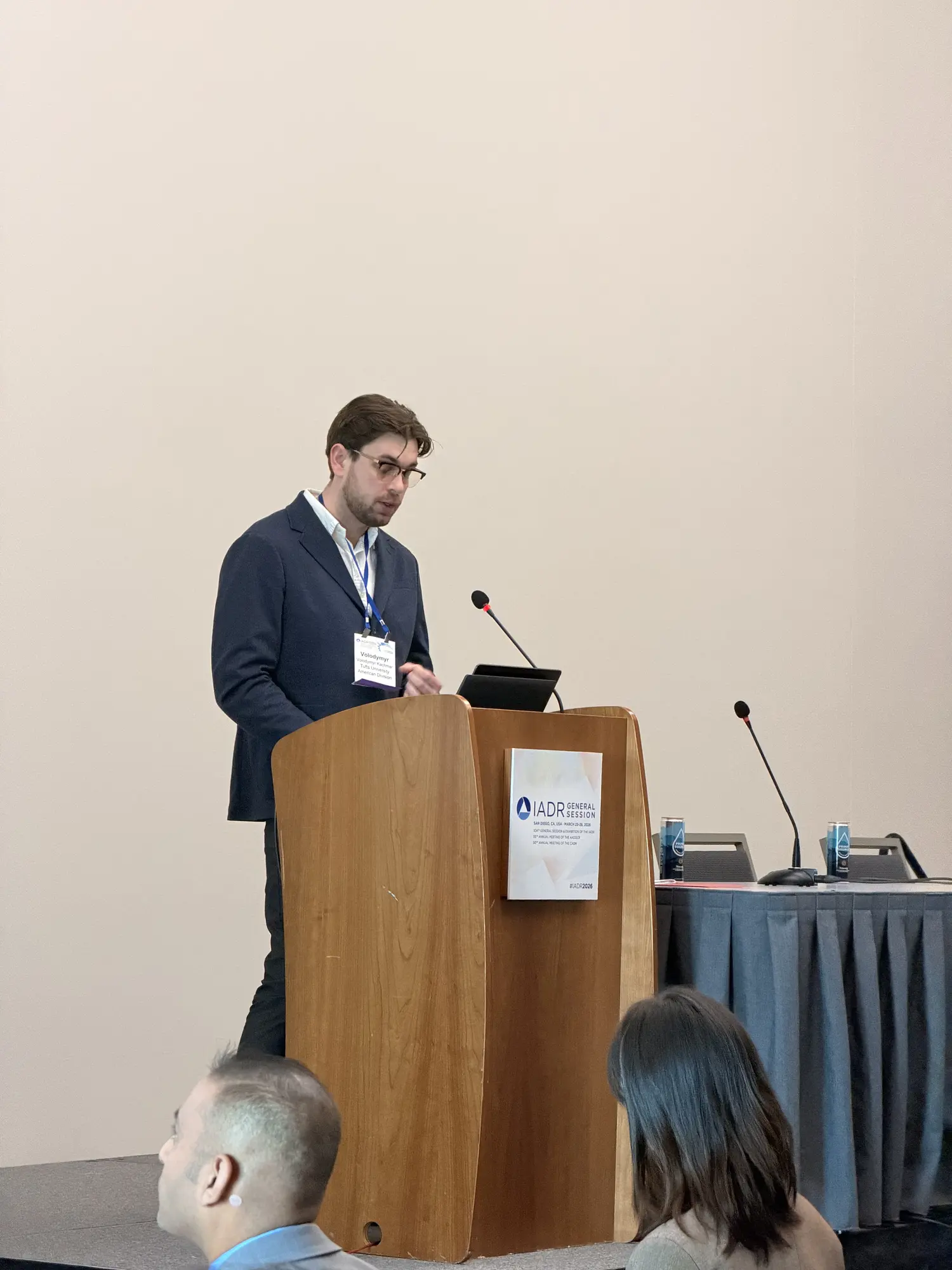 Dr. Volodymyr Kachmar delivering an oral research presentation at IADR 2026 General Session in San Diego.