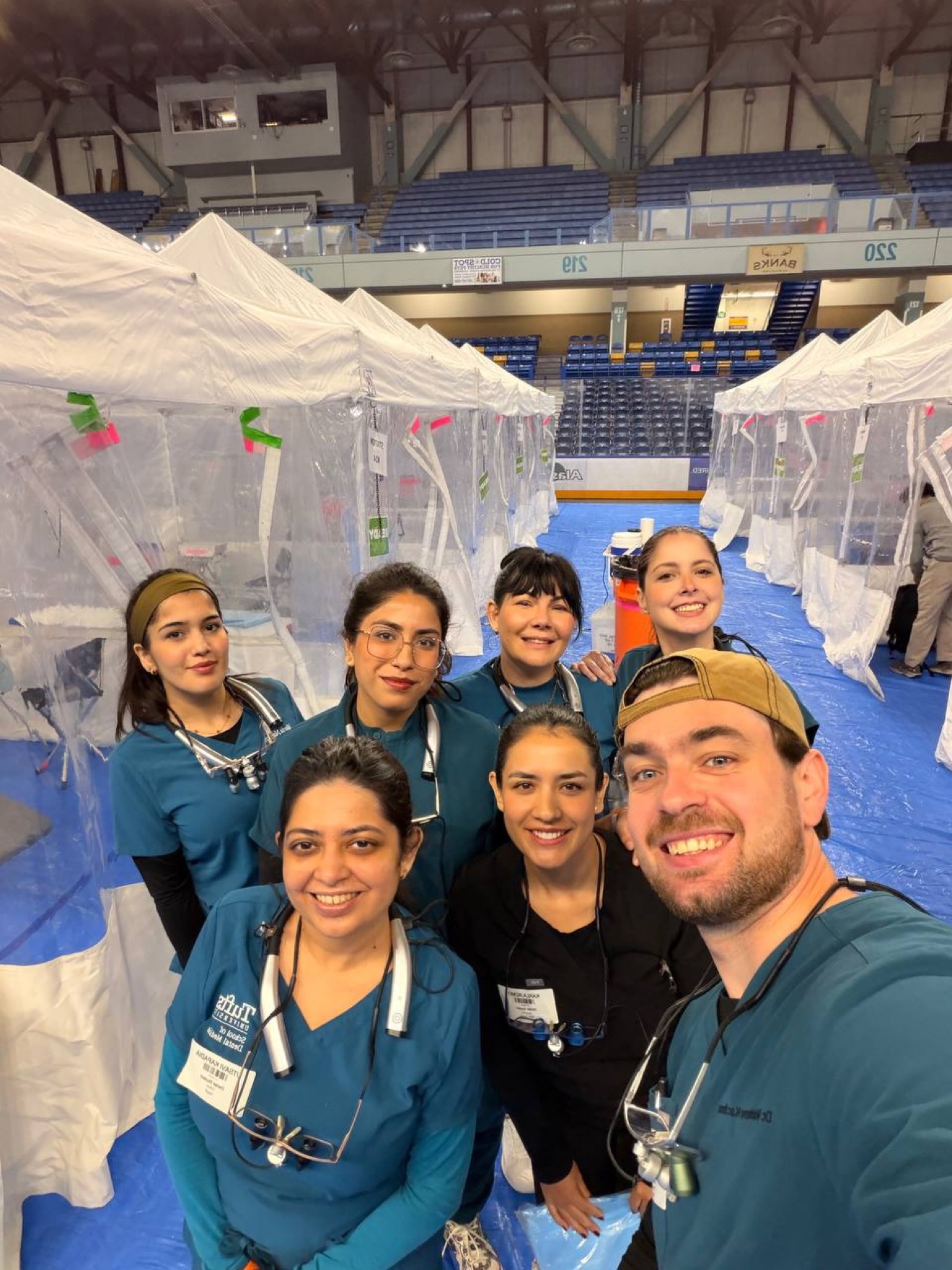 Dr. Volodymyr Kachmar with fellow volunteers at the RAM clinic treatment stations.